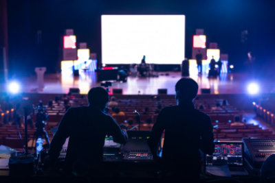 people preparing the stage for the concert